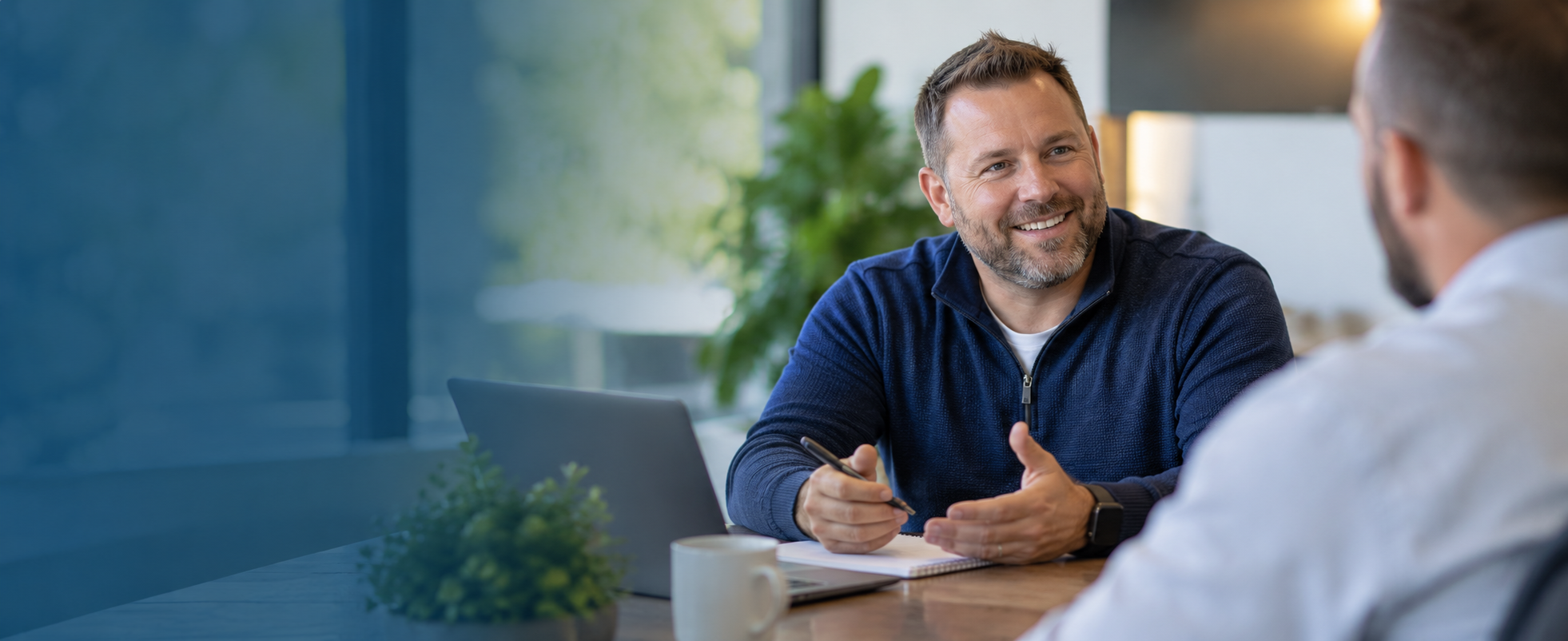 Brad Way meeting with a business owner to talk through their benefits